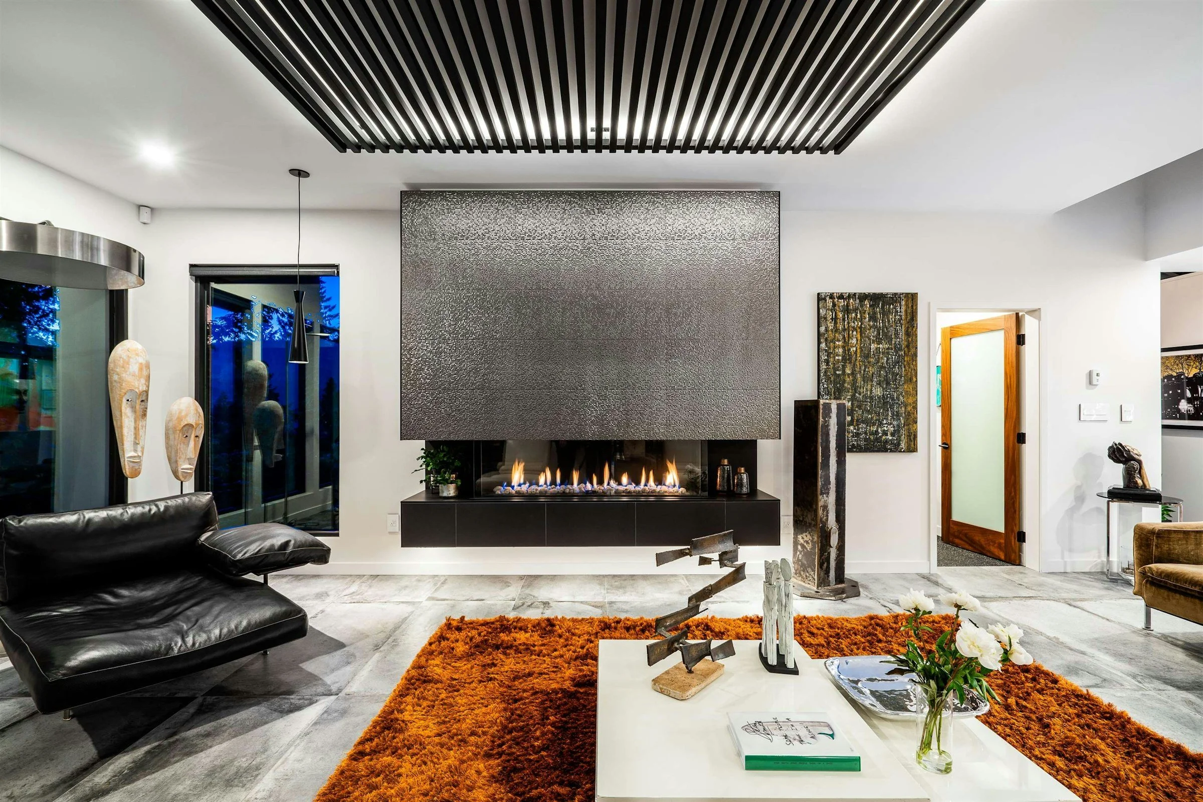 High quality fireplace remodel, stylish tile, living room renovation.