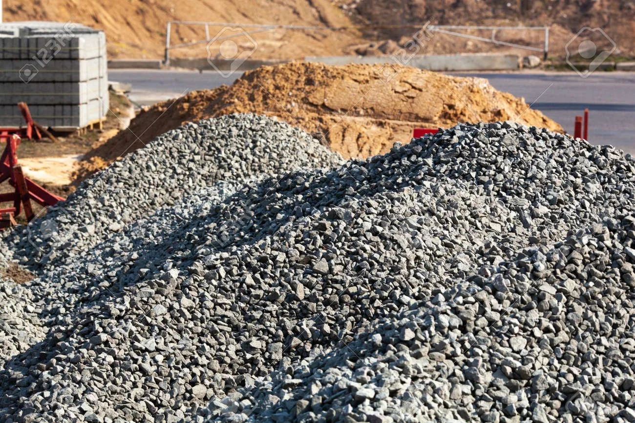 146057013-large-piles-of-construction-sand-and-gravel-used-for-asphalt-production-and-building-limestone.jpg