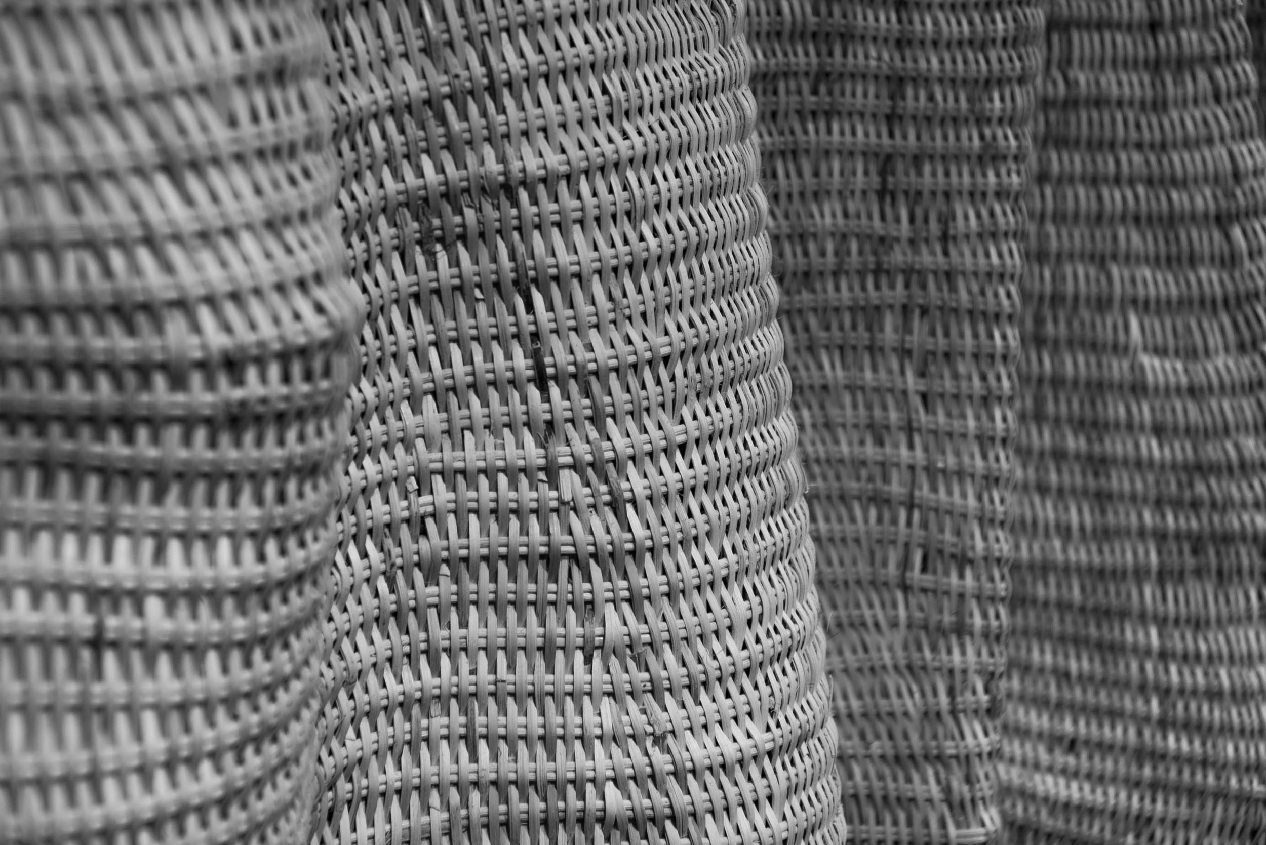 Close-up of stacked woven wicker baskets.