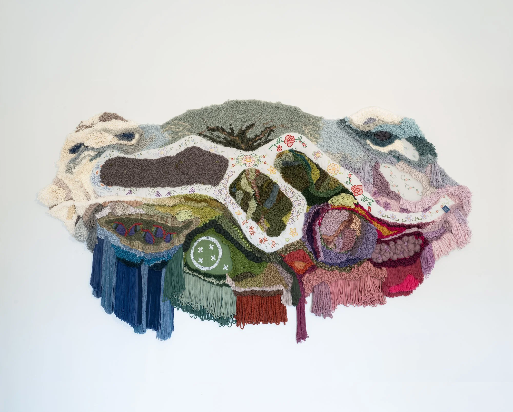 Full view of 'A Ilha' by Vilma Florença. Organic wool and Madeira Embroidery.