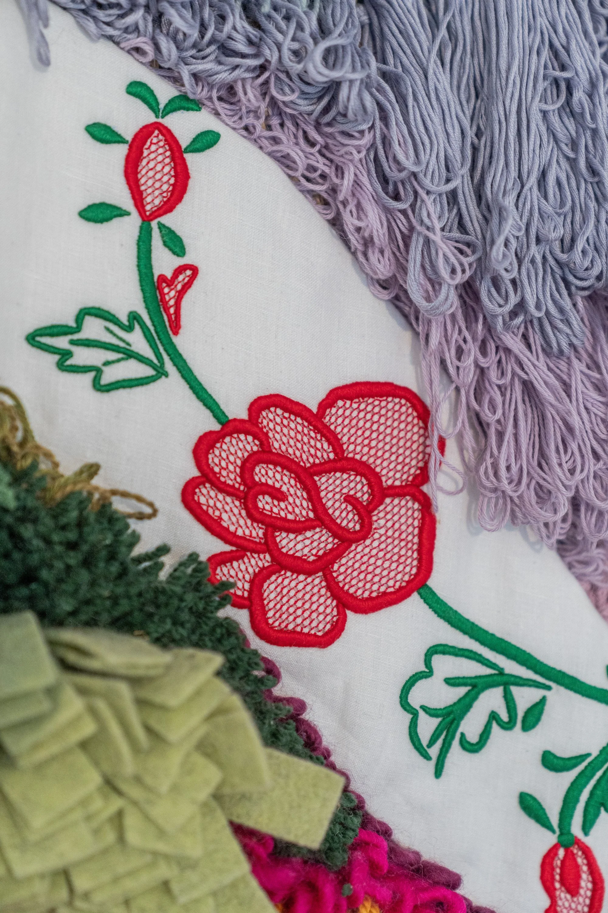 Close-up of Madeira Embroidery stitches on the textile surface.