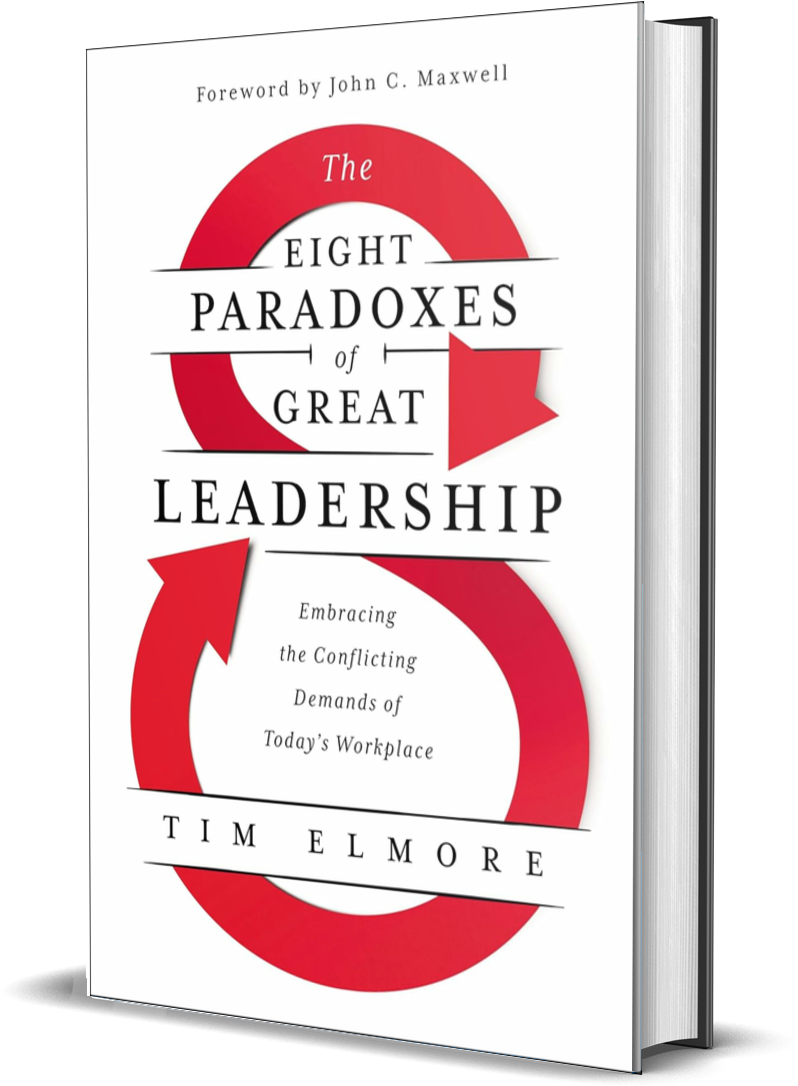 Cover of a book titled 'The Eight Paradoxes of Great Leadership' by Tim Elmore with a subtitle 'Embracing the Conflicting Demands of Today's Workplace'; the cover features red arrows forming a loop.