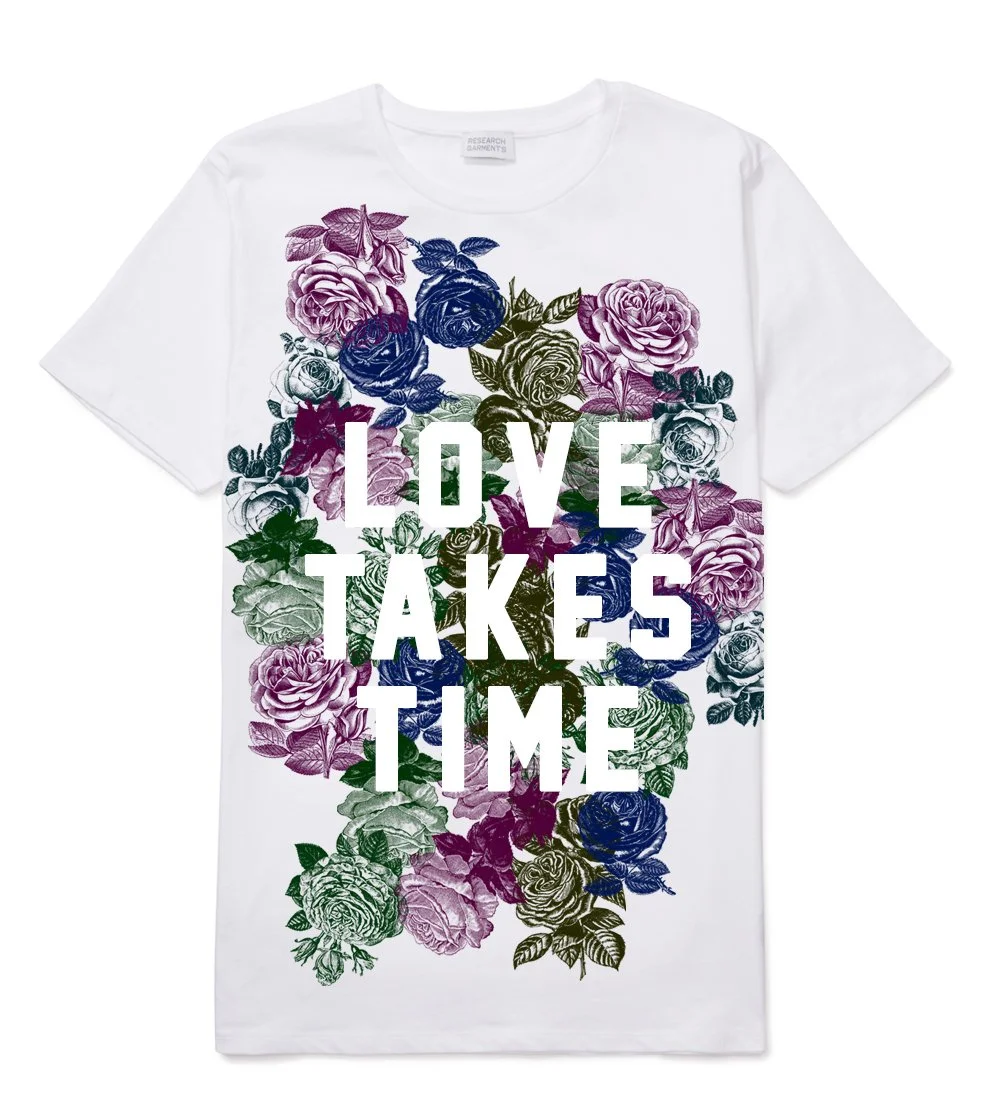 White T-shirt with a floral design and the words 'LOVE TAKES TIME' printed on the front.