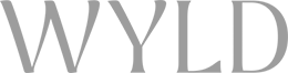 The word 'WYLD' in black stylized text on a dark background.
