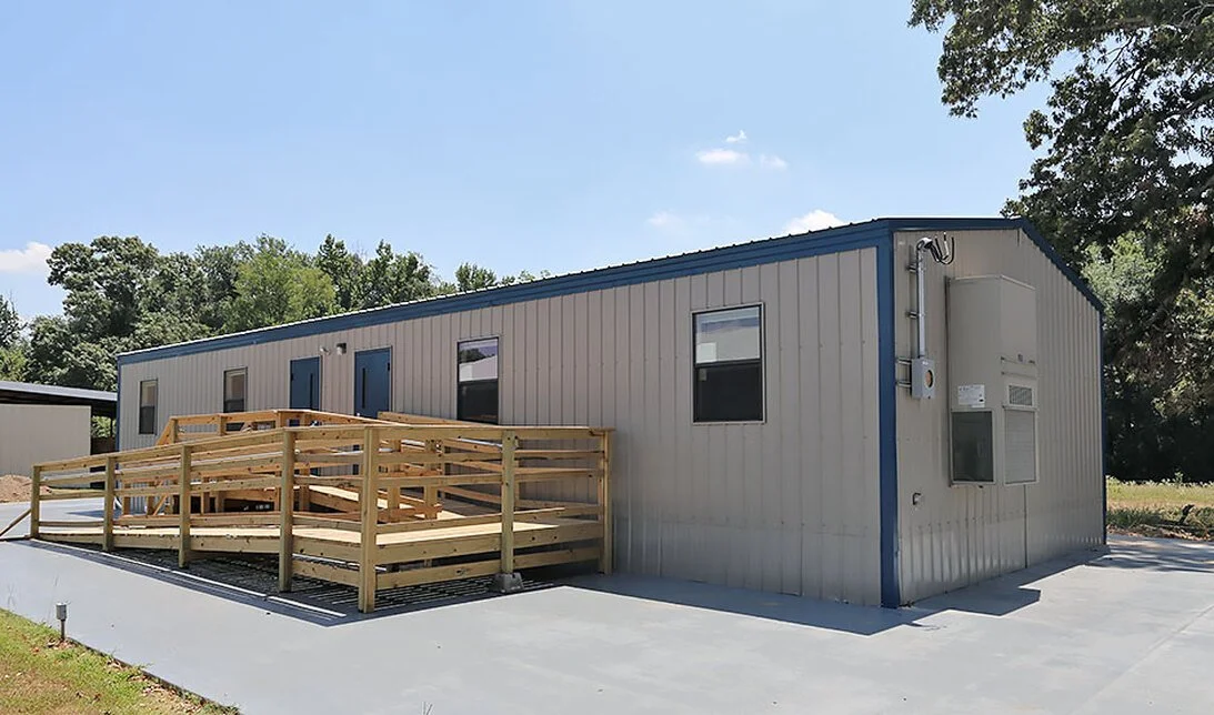 Completed modular building with integrated accessibility system, demonstrating how structural design aligns with real site use, foundation support, and code-compliant access requirements.