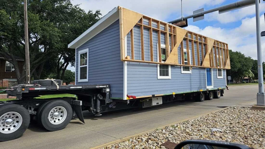 Transport phase of a modular unit highlighting the importance of structural integrity during lifting, hauling, and temporary support conditions.