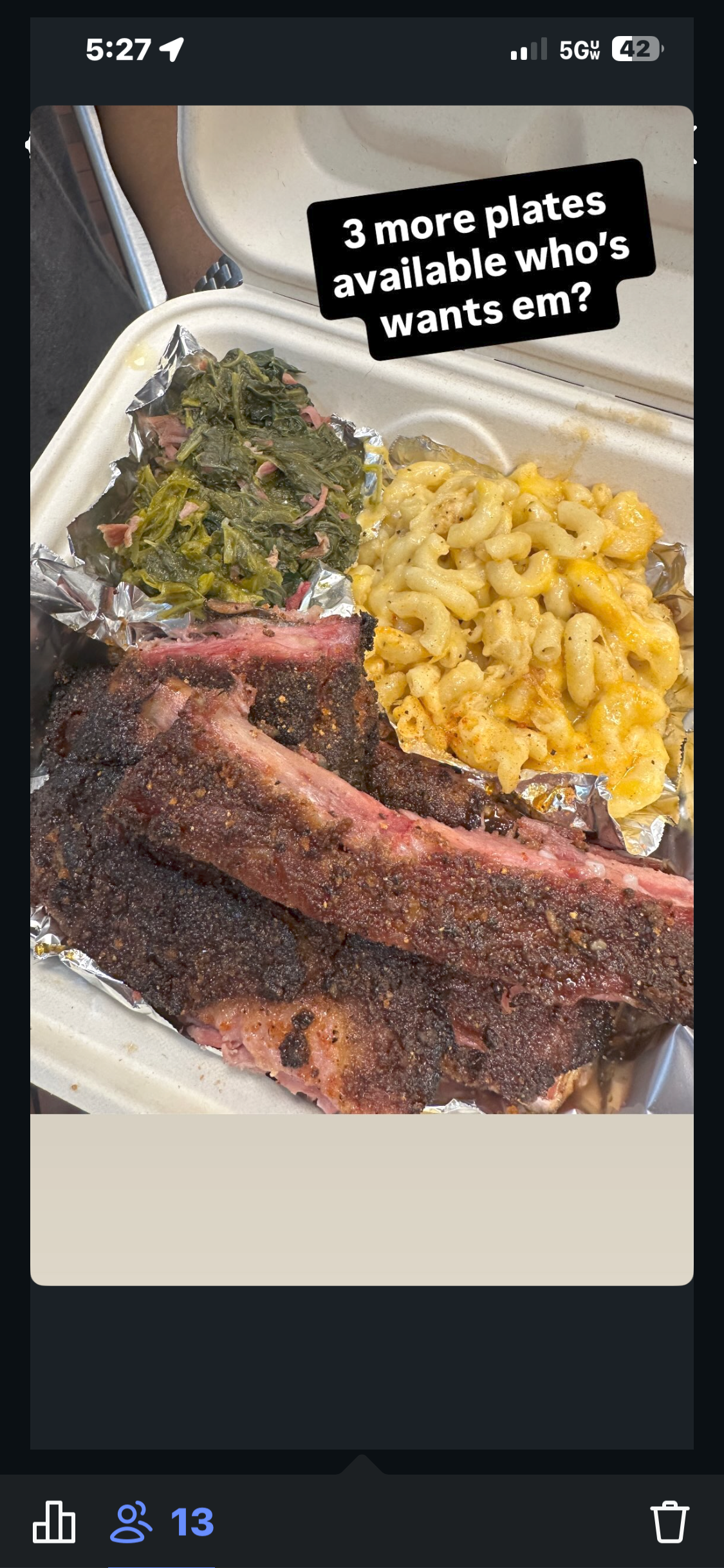 Barbecue meal with smoked ribs, macaroni and cheese, and greens in a foam takeout container.