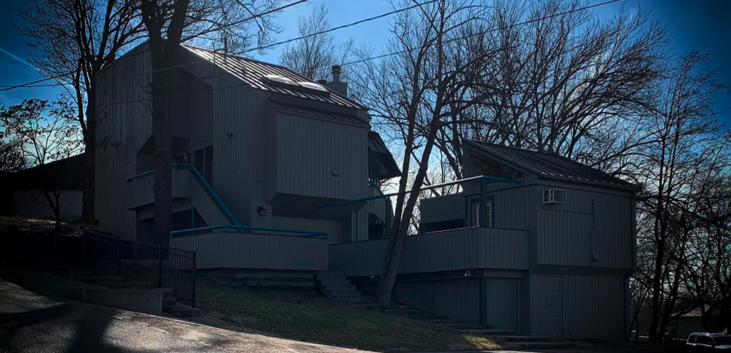 Custom standing seam metal roof enhancing both structural protection and modern architectural aesthetic.