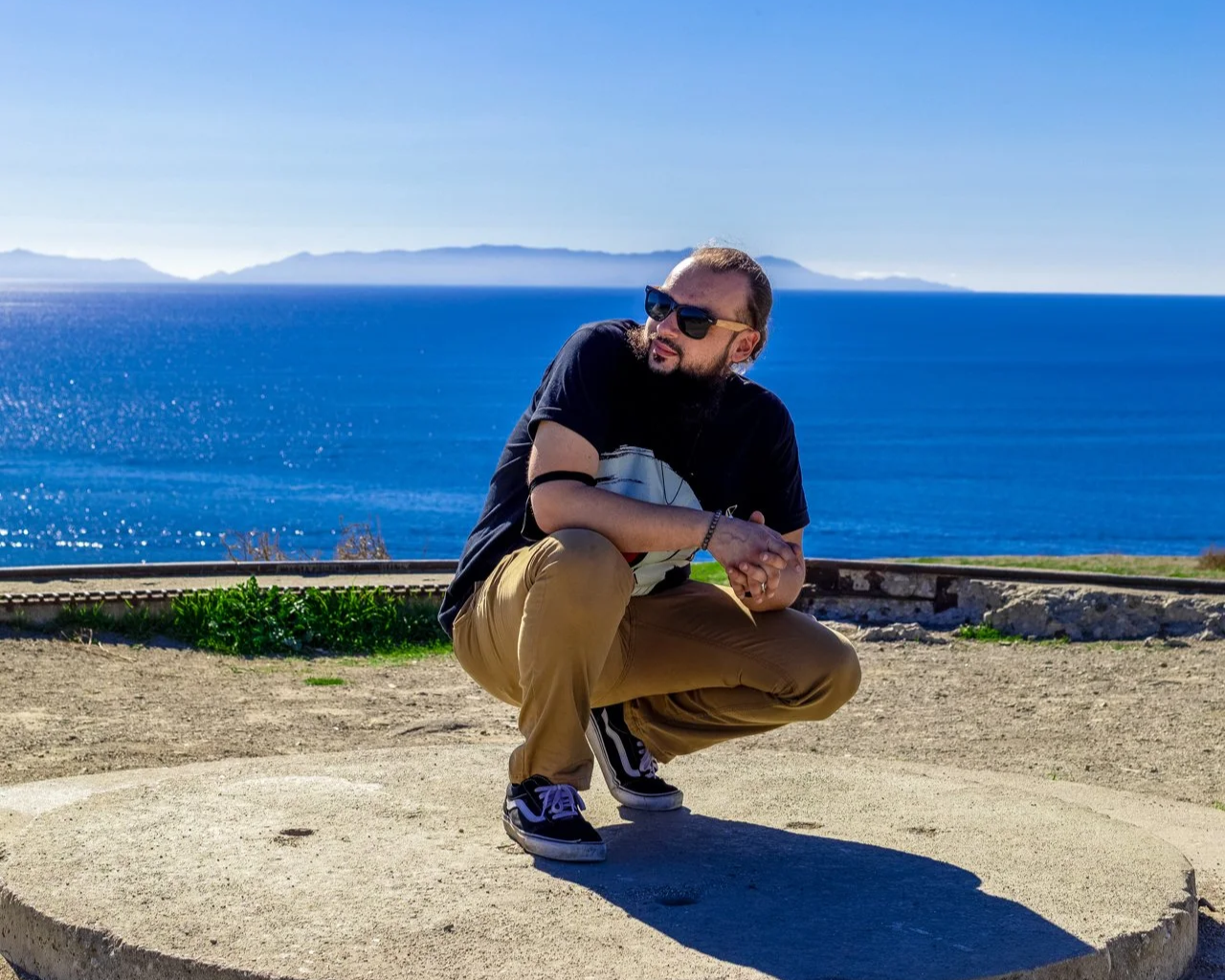 Scendsei sitting at the top of a Pacific Ocean shoreline cliff
