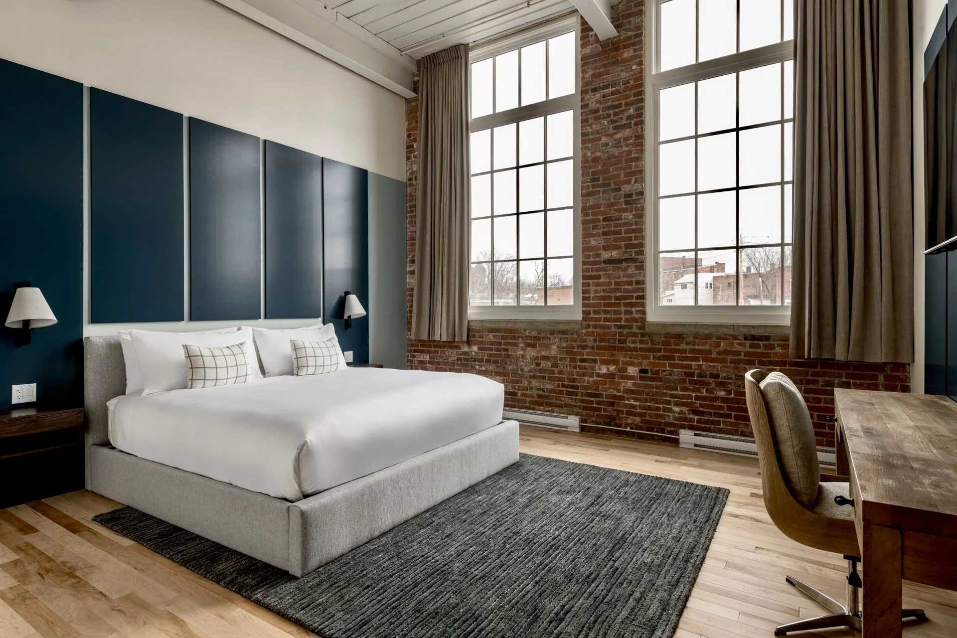 hotel room industrial brick exposed blue headboard custom.jpg