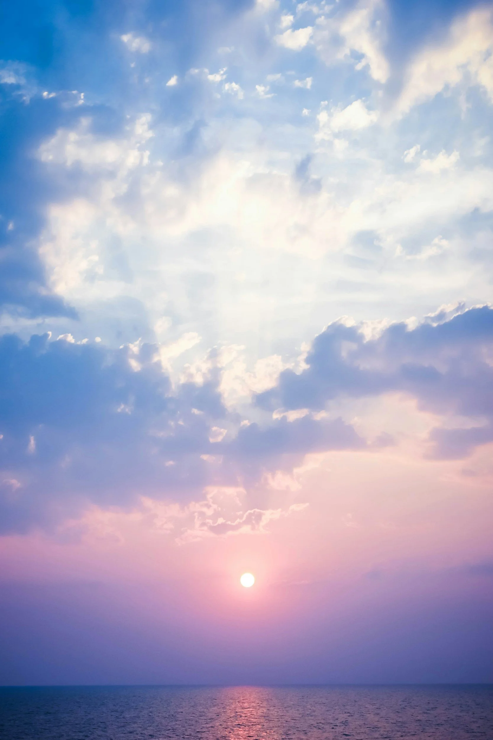 Sunrise over calm water representing healing, personal growth, and support through women's mental health counseling