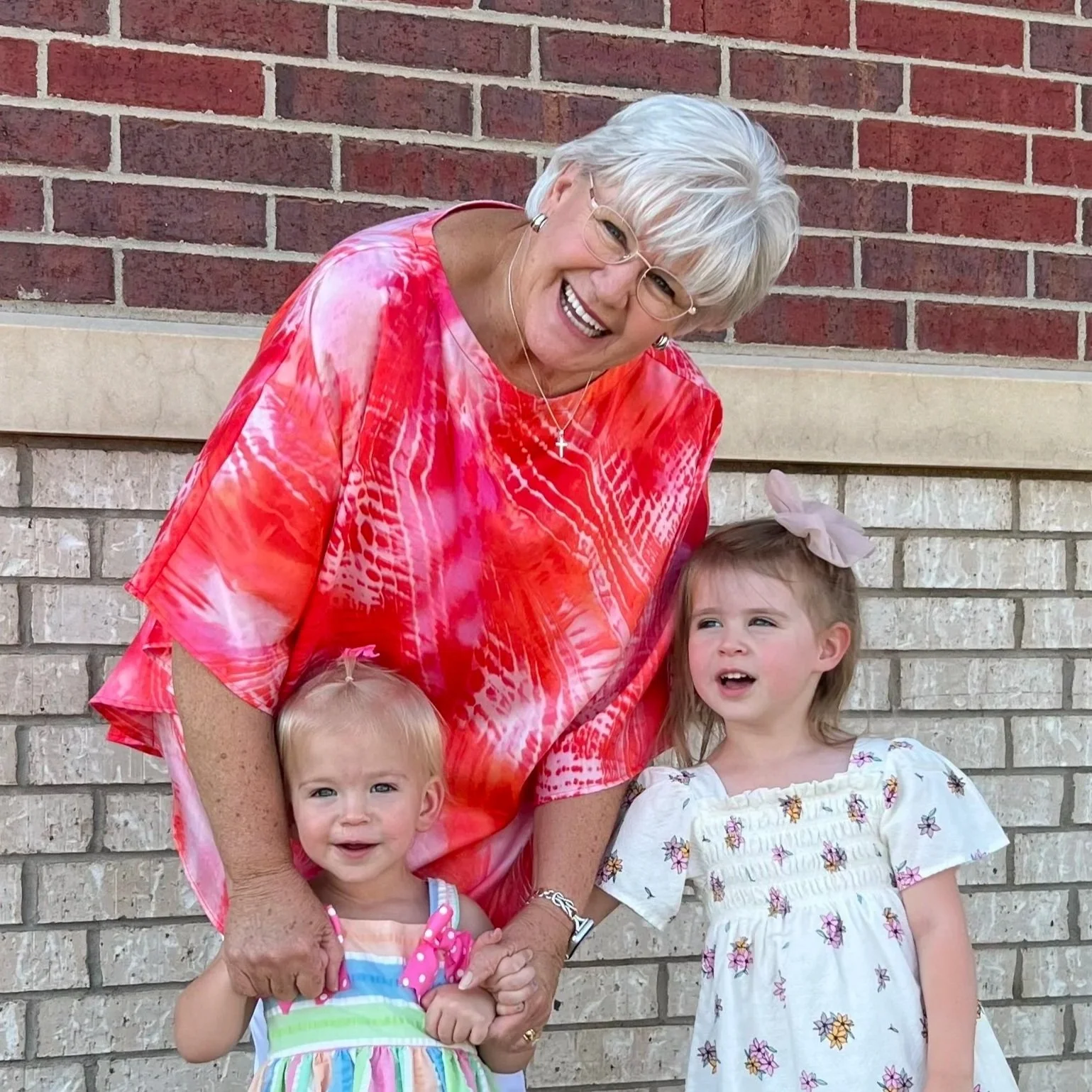 Woman with her two grandchildren sharing a testimonial