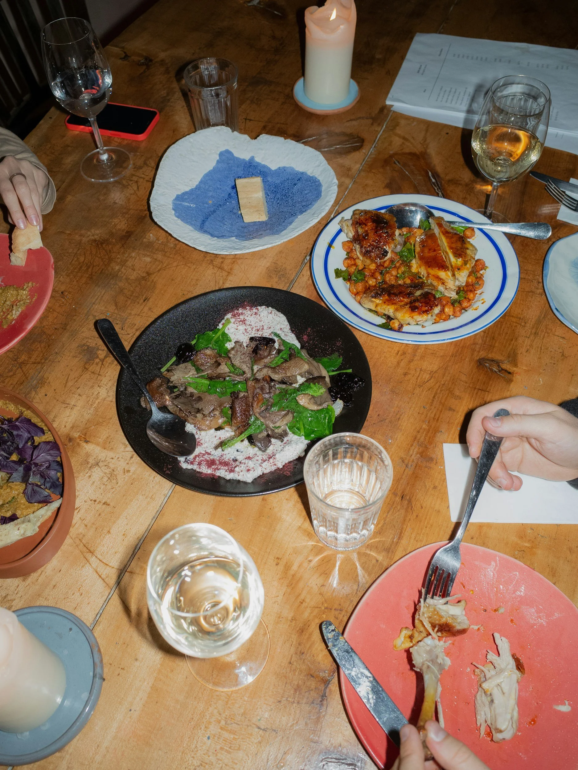 Table filled with an assortment of dishes from favorite restaurants around the world.