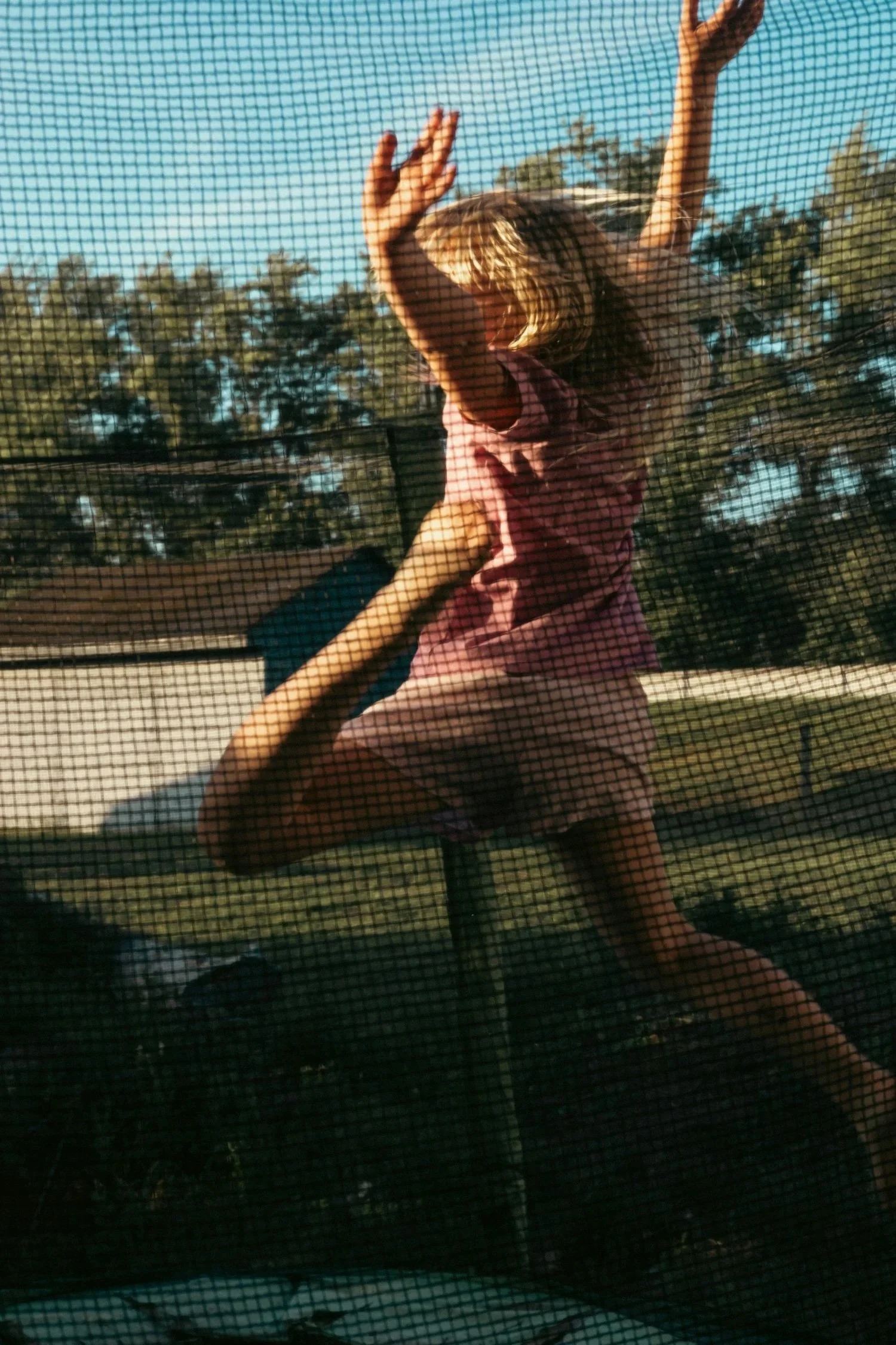 Little girl jumping on trampoline