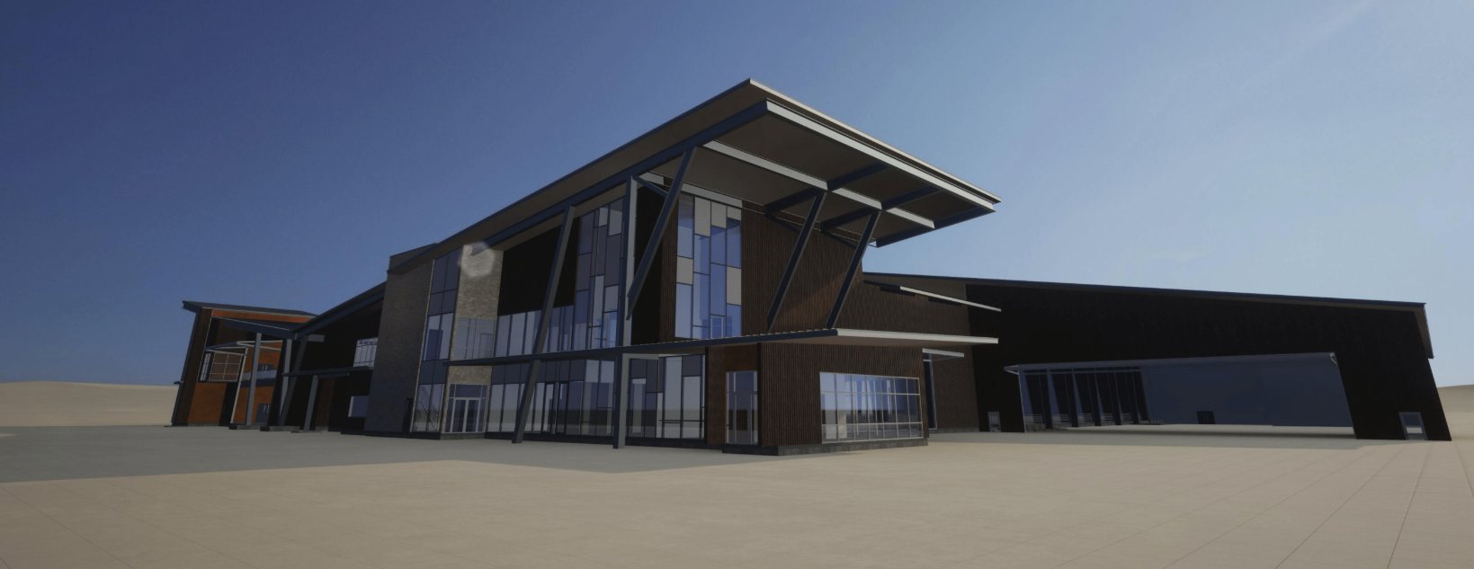 Modern architectural building with large glass windows, angled roofs, and metal supports, set against a clear sky.