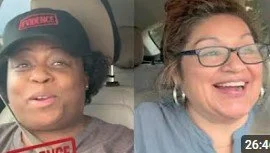 Two women smiling, one wearing a hat and glasses, the other with glasses and earrings.