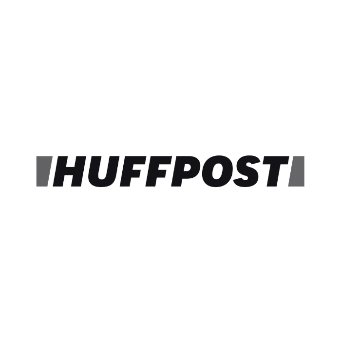 HuffPost logo in black font with grey accents on a transparent background.