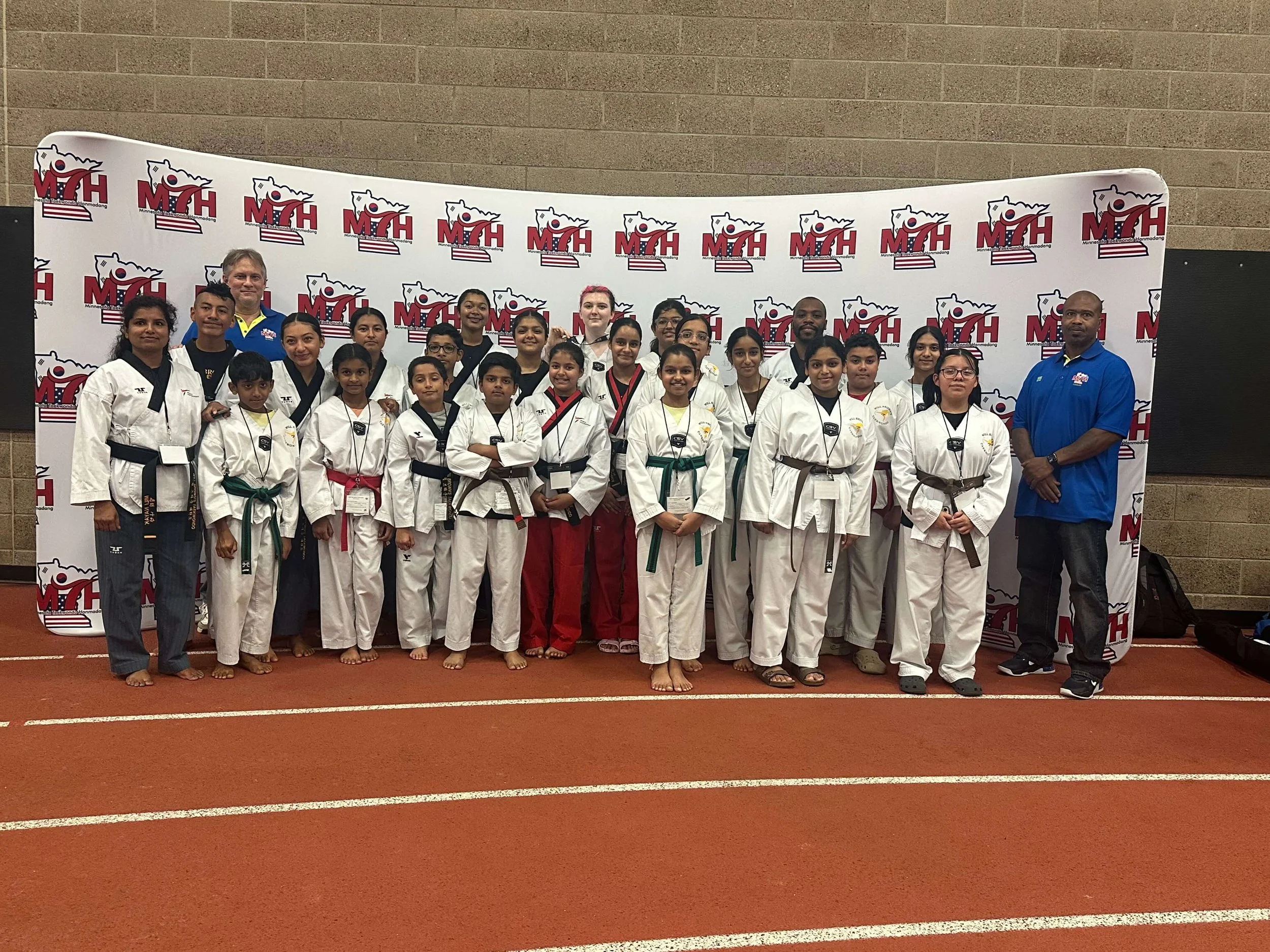 Will Brown's Taekwondo students and instructors pose together at the Minnesota Taekwondo Hanmadang tournament.