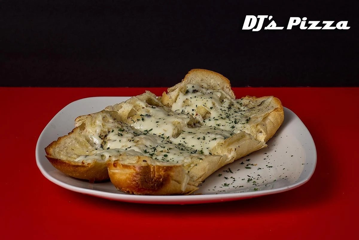 Slices of garlic bread topped with melted cheese and herbs on a white plate, with a black and red background and the text 'DJ's Pizza' in the top right corner.