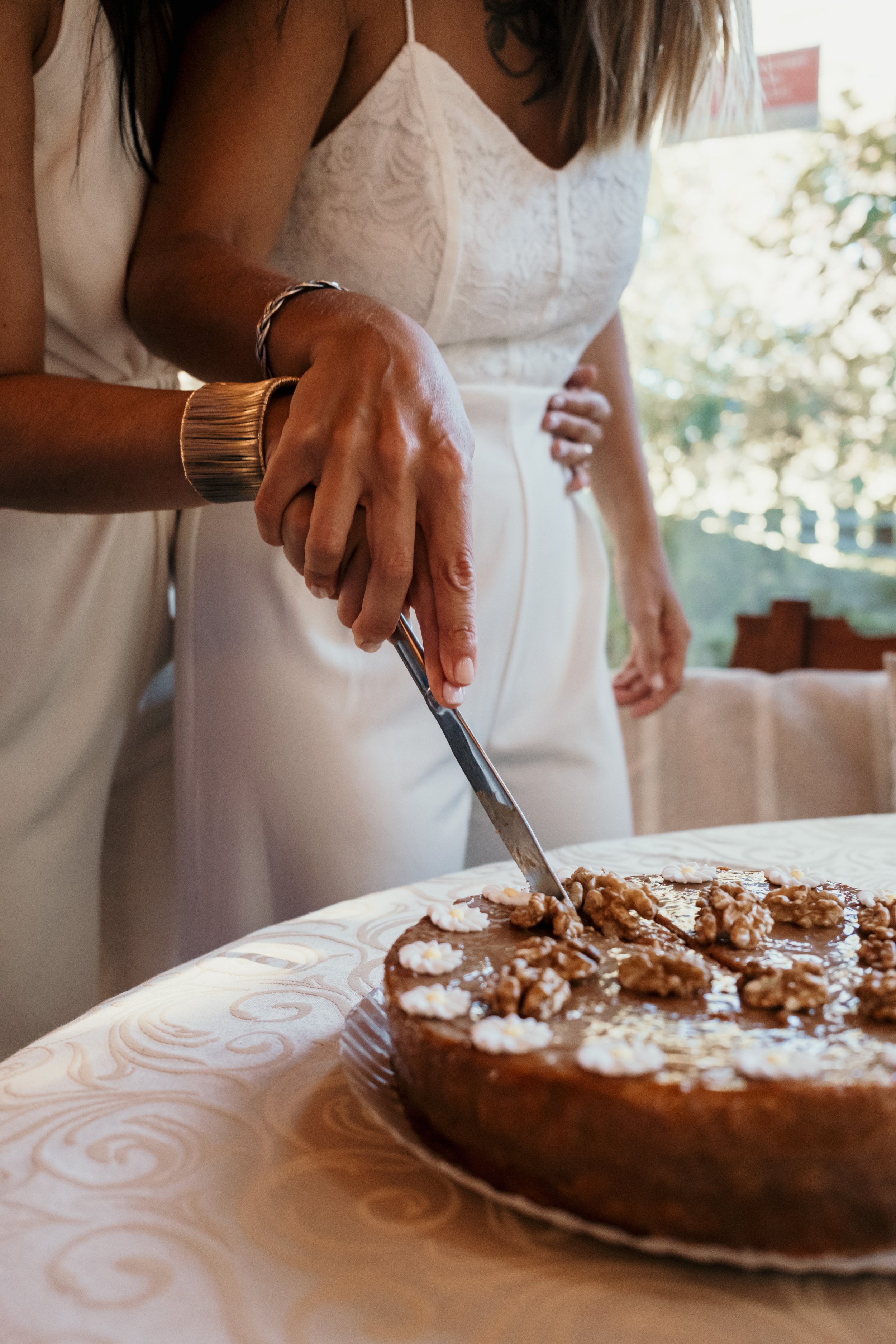 Sofia and Leonor cutting their wedding cake during their celebration in Sintra.