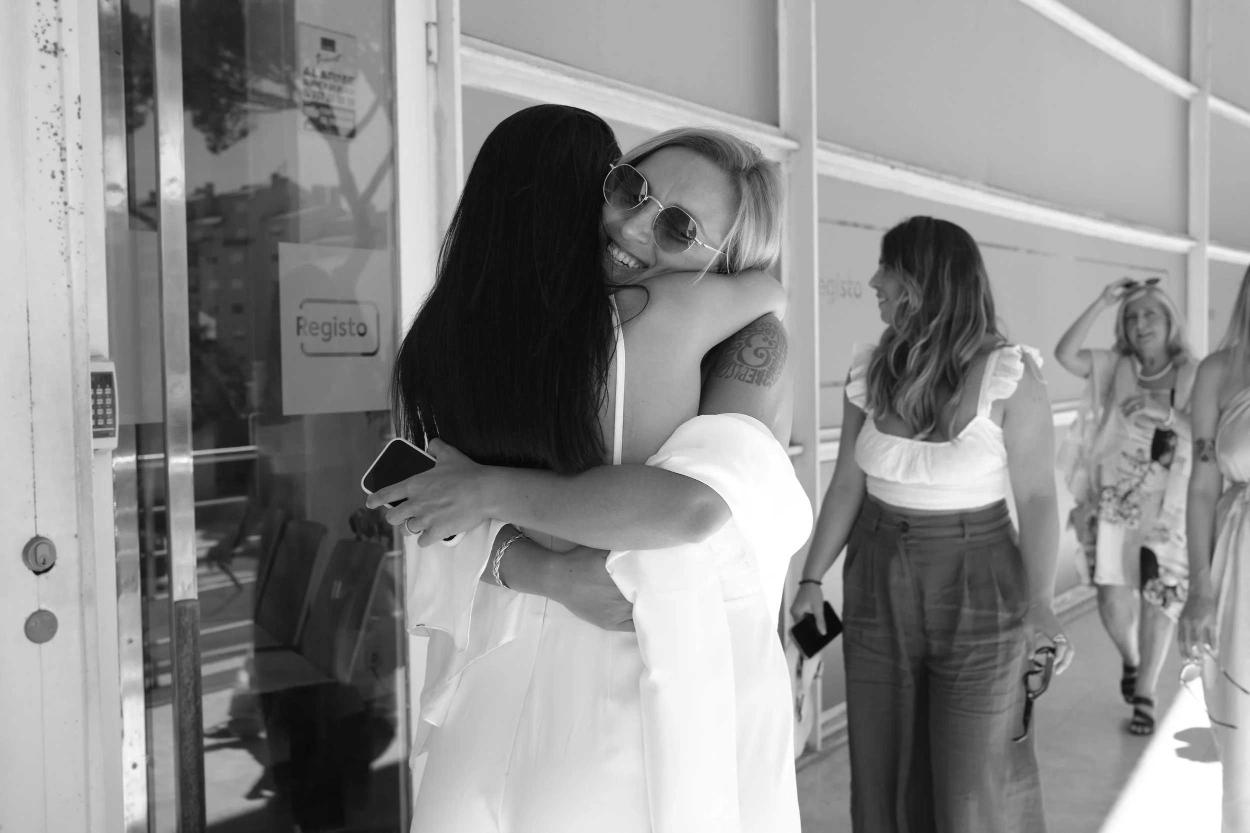 Emotional first look between Sofia and Leonor before their intimate wedding ceremony in Cascais.