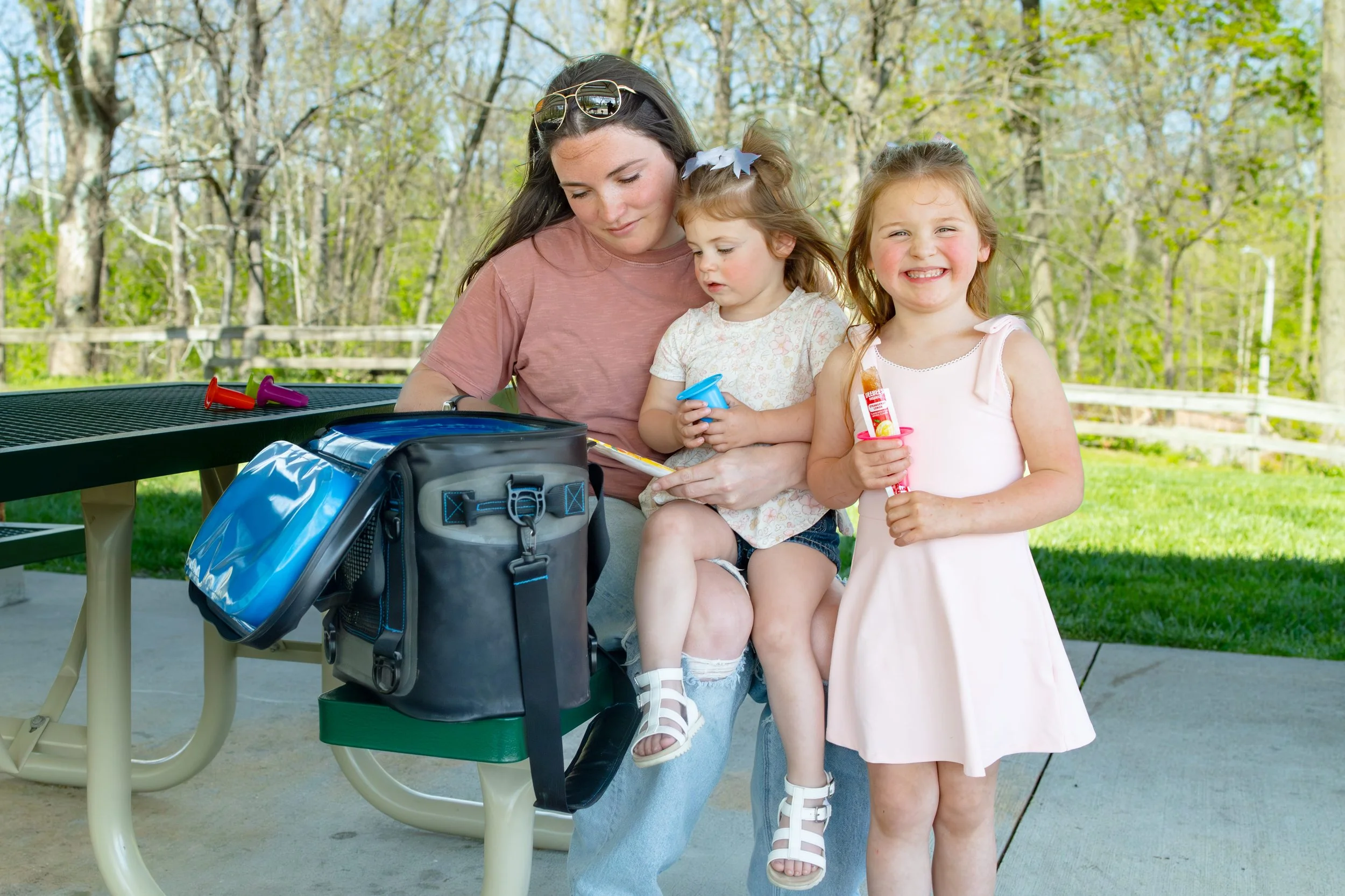 mom and children eating ice pops with a pop pal