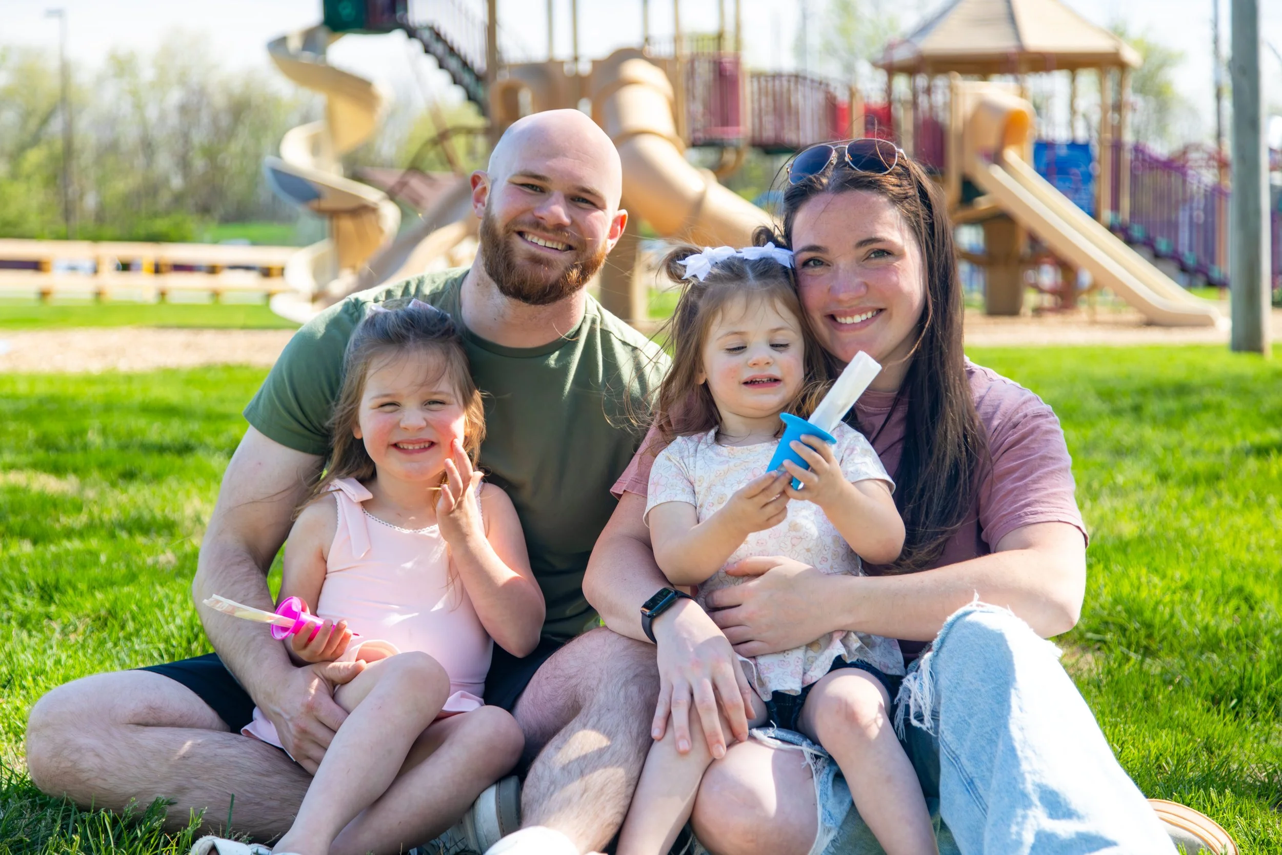 family at a park using pop pals to enjoy an ice pop