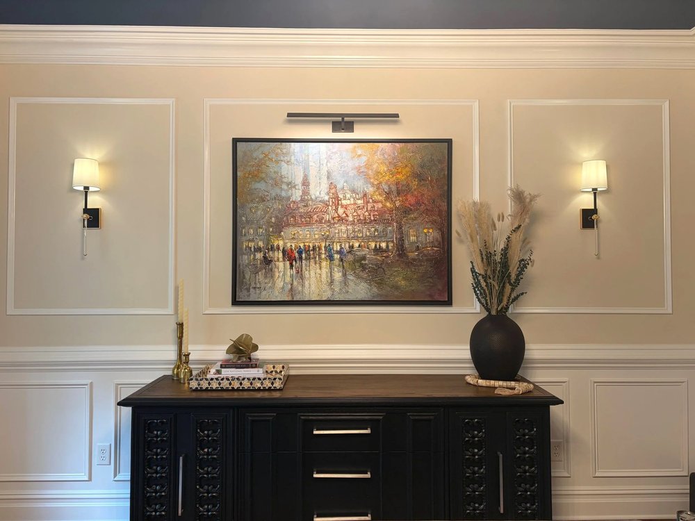 Sideboard, artwork, and layered accessories