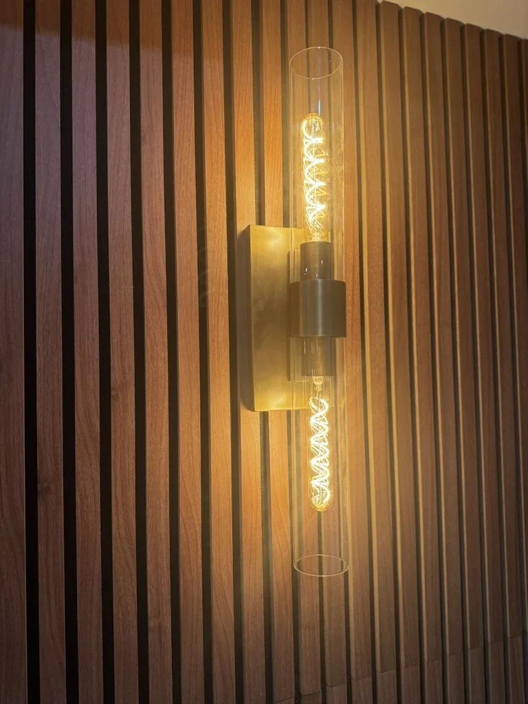 Brass and glass wall sconce