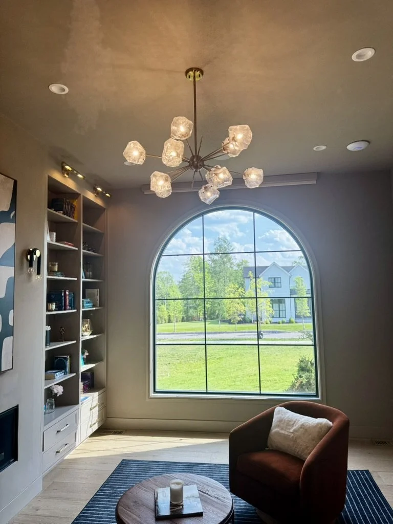 Sculptural glass chandelier in the den