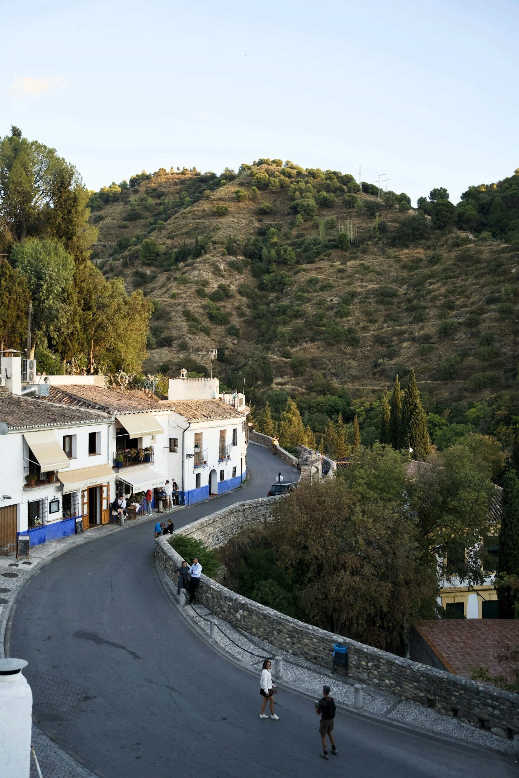 White village houses on a hillside road in southern Spain