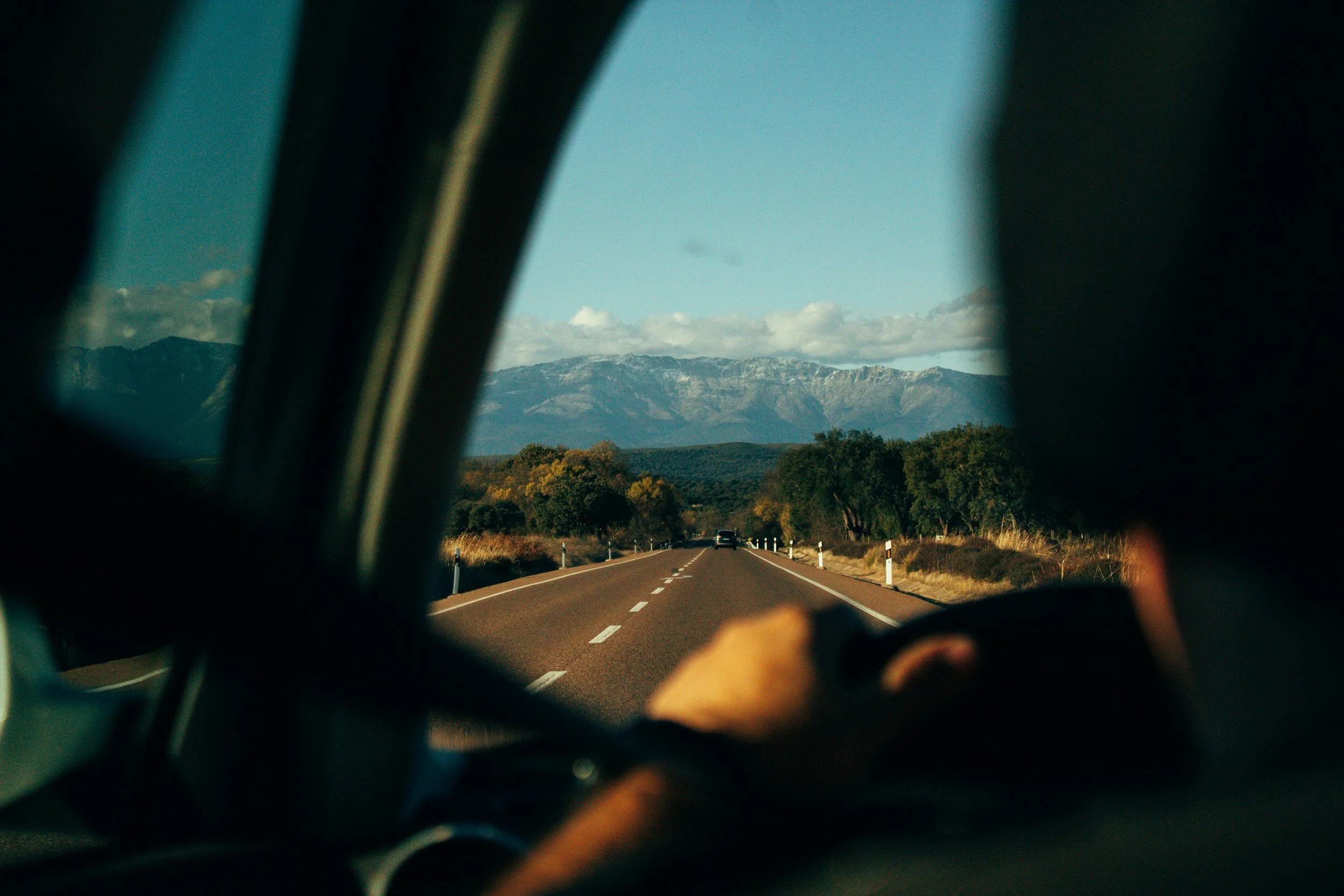 Driver's view through the windscreen of a mountain road in Spain