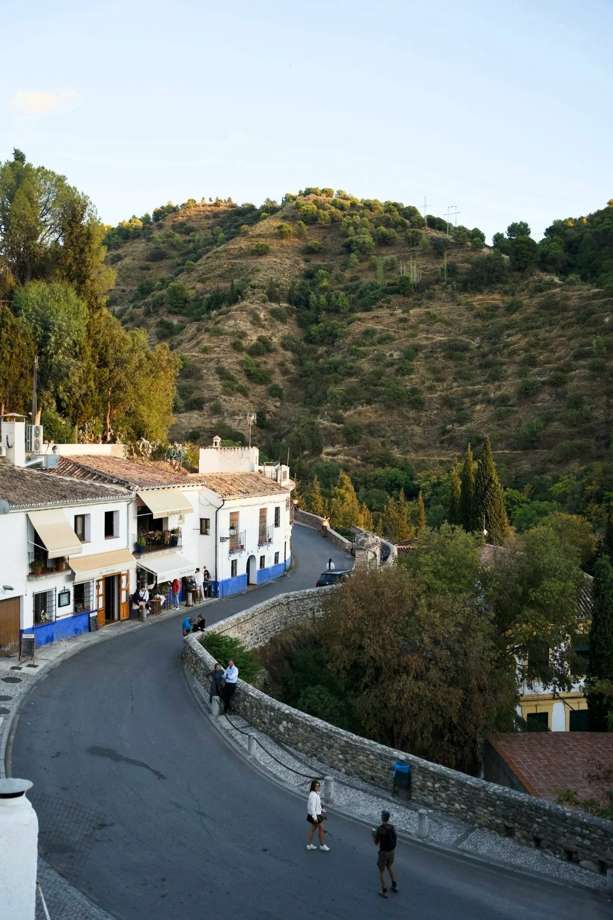 White village houses on a hillside road in southern Spain