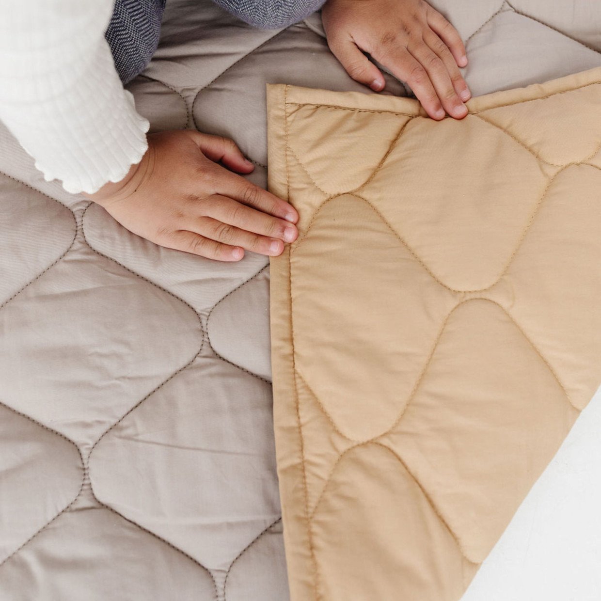 Gray and beige picnic blanket on Rachel Bernhard's Baby Registry page.