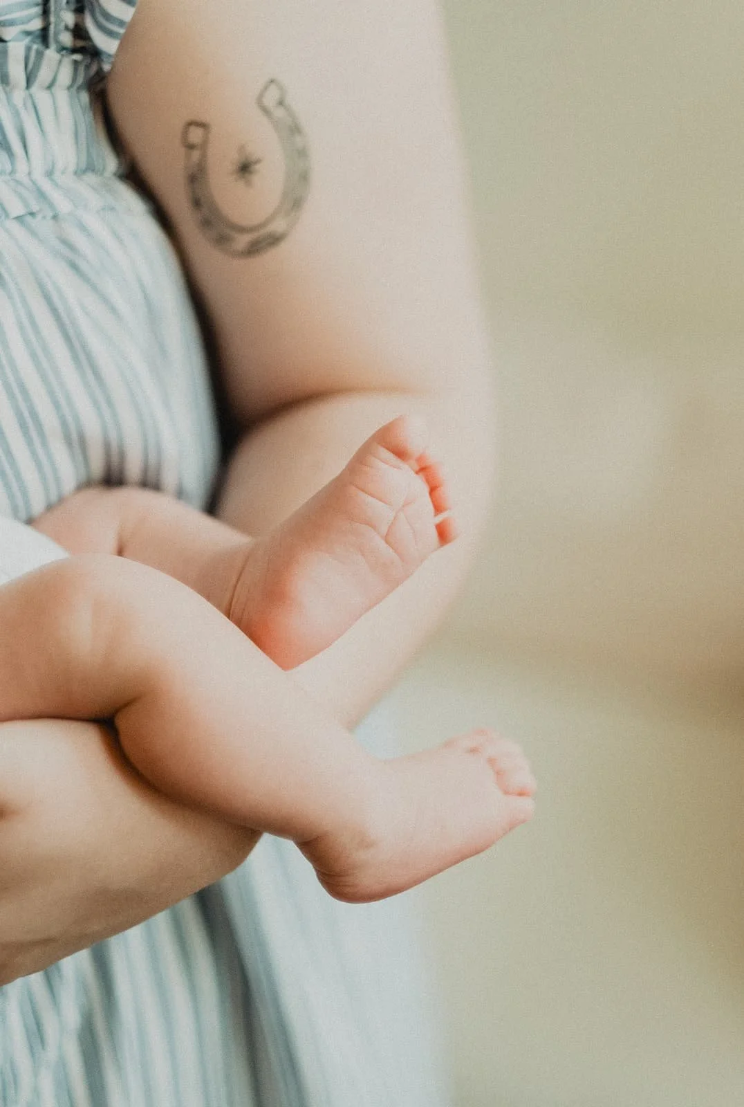 A mother and member of The Postpartum Village receives fourth trimester support from her virtual motherhood circle with holding her newborn.