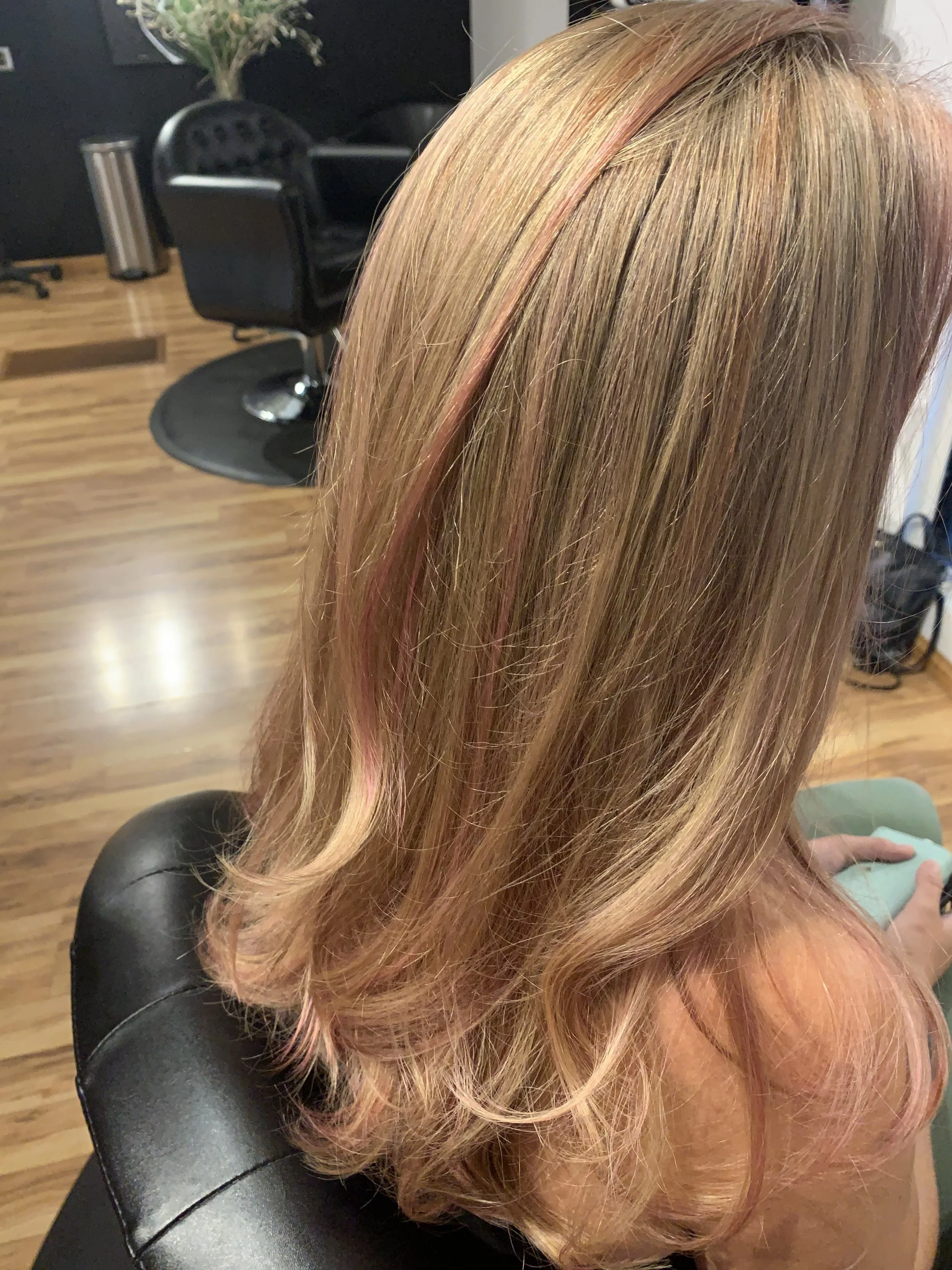 Rose gold highlights on blonde medium haircut by Cherry Creek Denver stylist