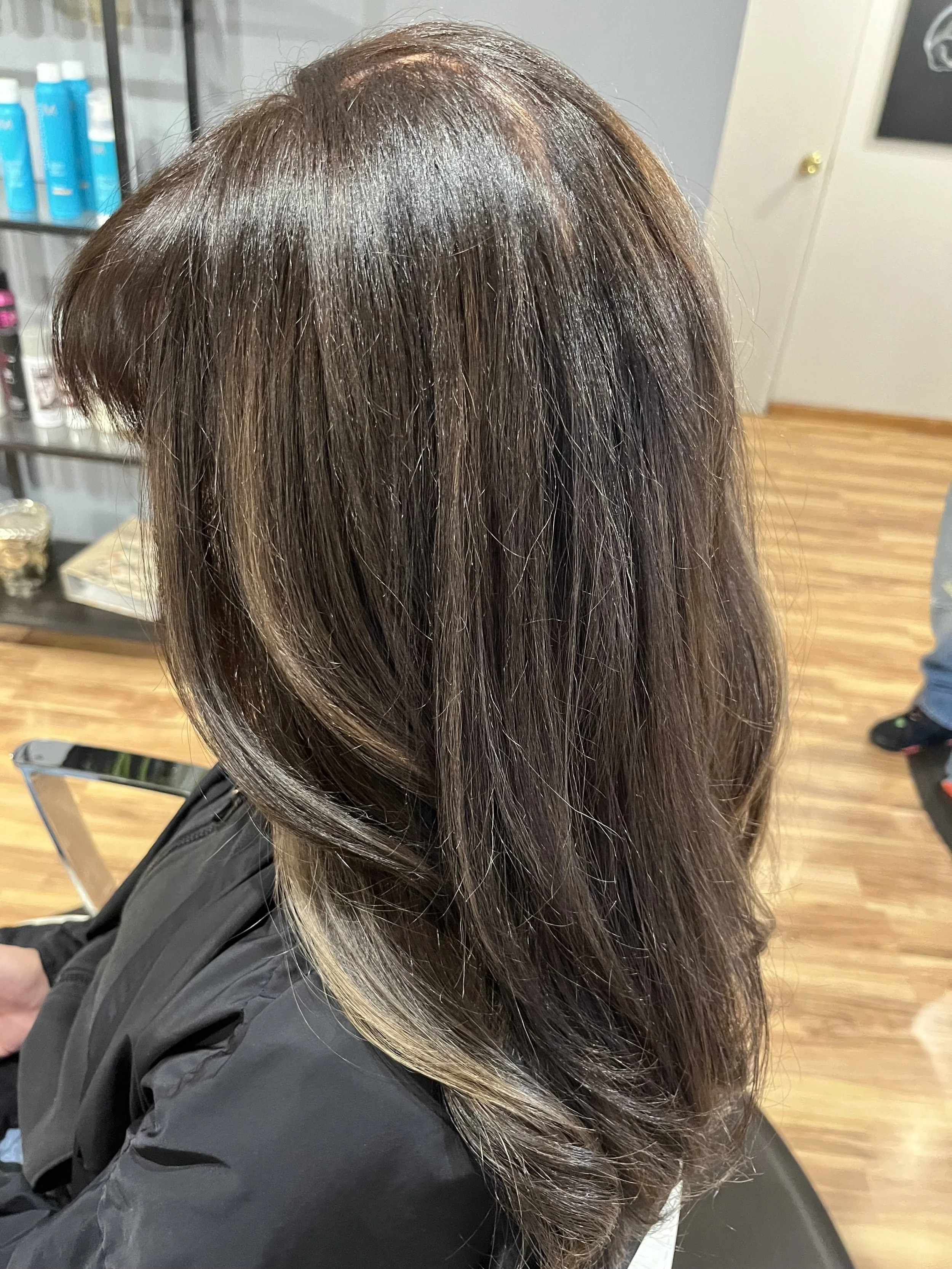Cool toned brunette with blonde low lights at Denver Cherry Creek salon