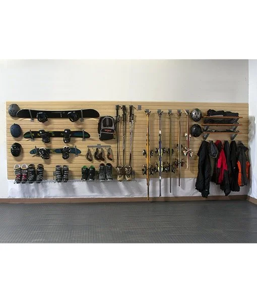 Wall-mounted wooden rack holding skateboards, Helmets, backpacks, baseball bats, bicycle pumps, and jackets