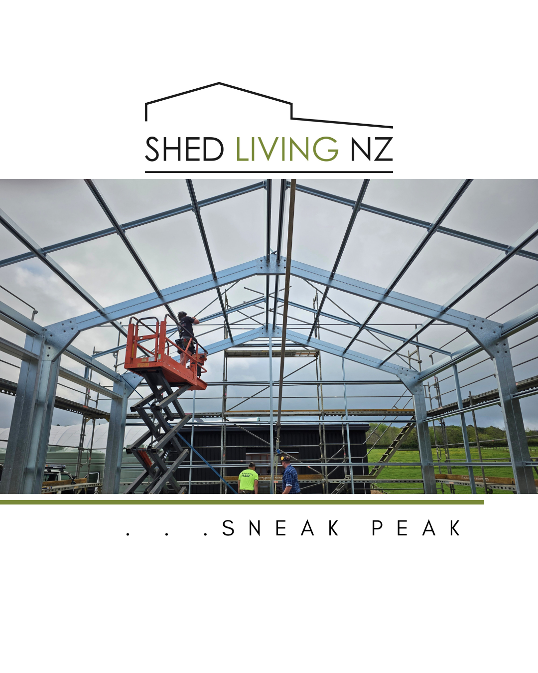 Construction workers building or assembling a metal shed or greenhouse frame outdoors on a cloudy day.