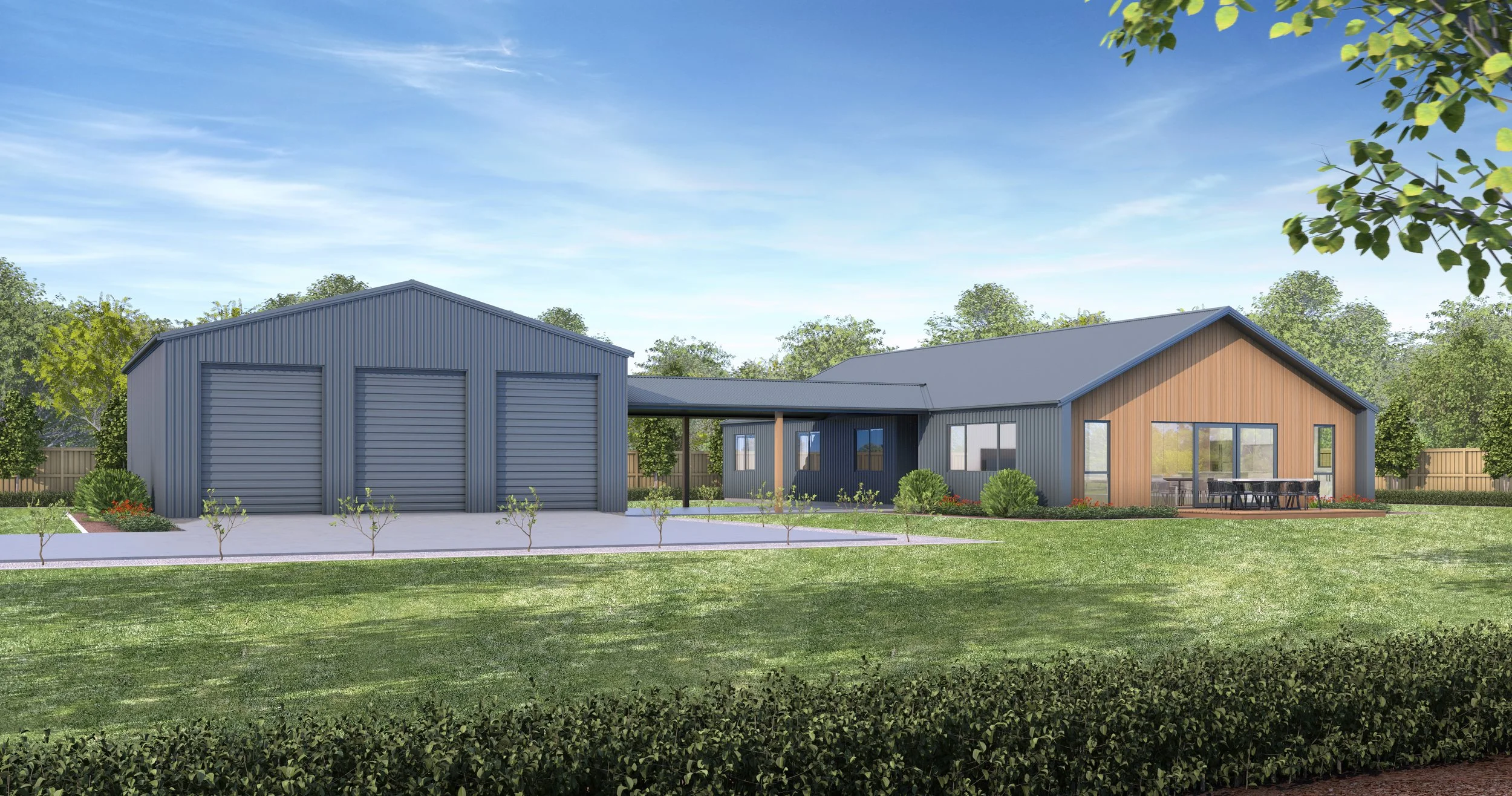 A modern house with a blue and brown exterior, large windows, a porch, a patio with a dining area, and a detached garage with three roll-up doors, set in a landscaped yard with grass, small trees, and shrubs.