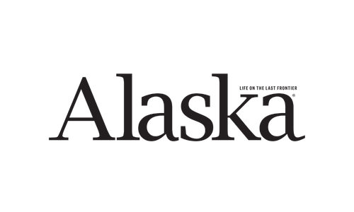The word 'Alaska' with the phrase 'Land of the Midnight Sun' written underneath, all in black text on a white background.