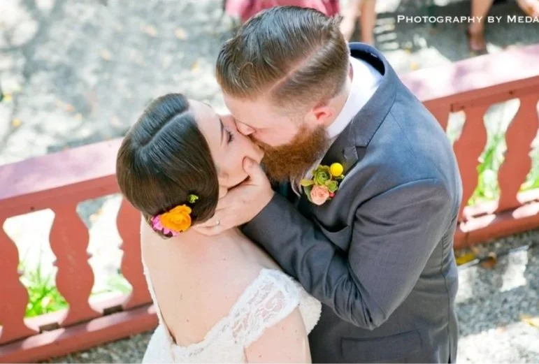 A bride and groom kissing at Nature Friends LA.