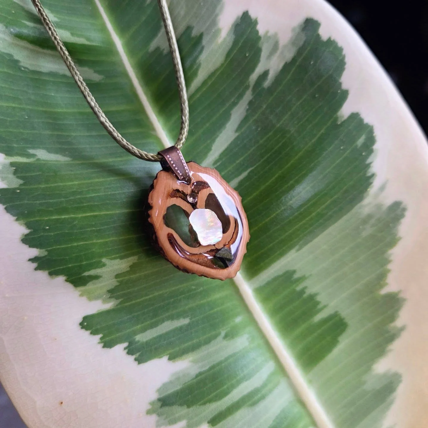 🧚&zwj;♀️These handcrafted walnut necklaces are made from real walnut shells, carefully shaped and finished by hand, then sealed with resin and natural elements.

 ✨️Each one carries its own unique grain pattern &mdash; no two are ever the same.

💖L