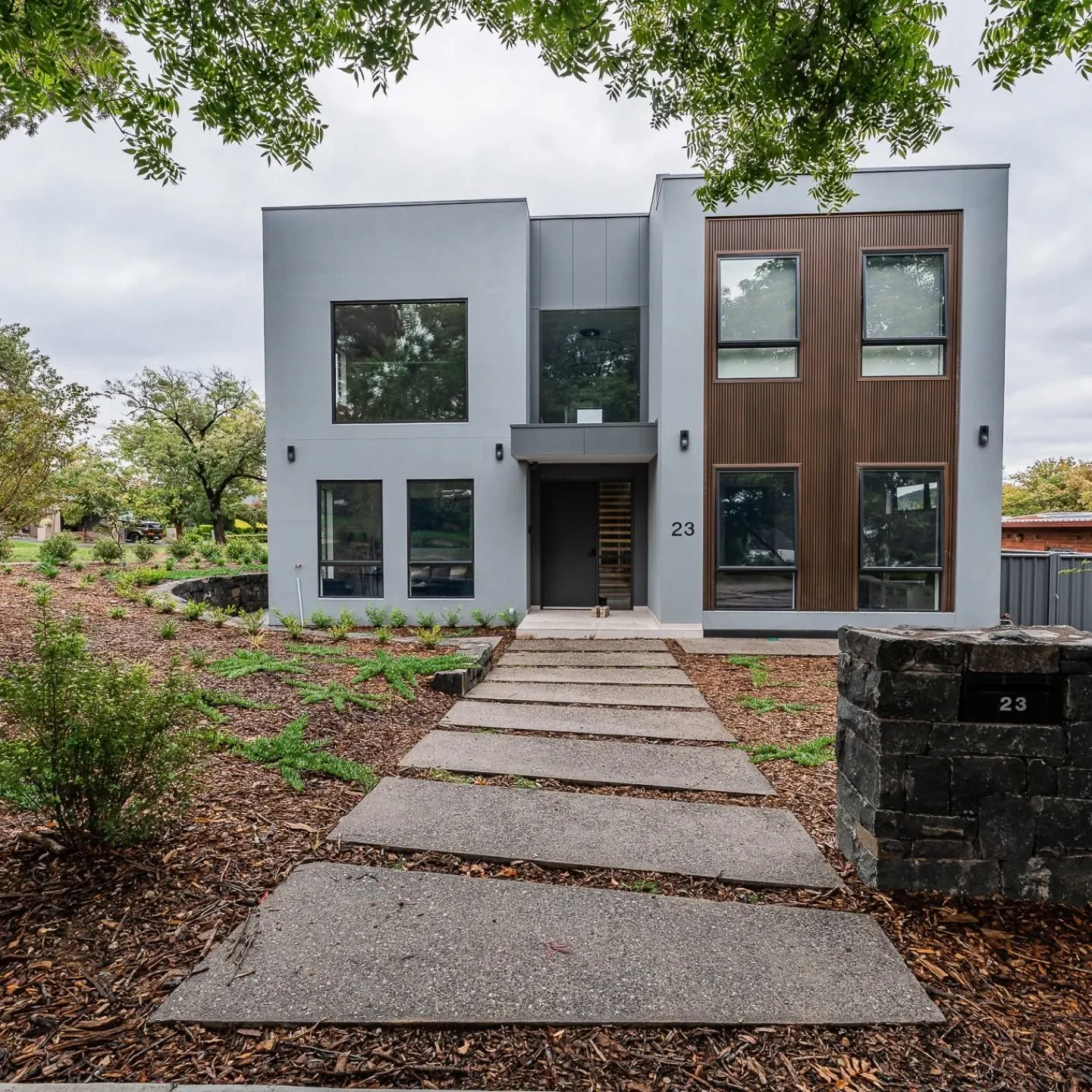 Our team finished our Yarralumla project last year. 

The Native garden we designed and planted really starting to take shape. 

We constructed a Nimmitabel mailbox with the curving walls around the landscape. 

Exposed aggregate concrete steppers th