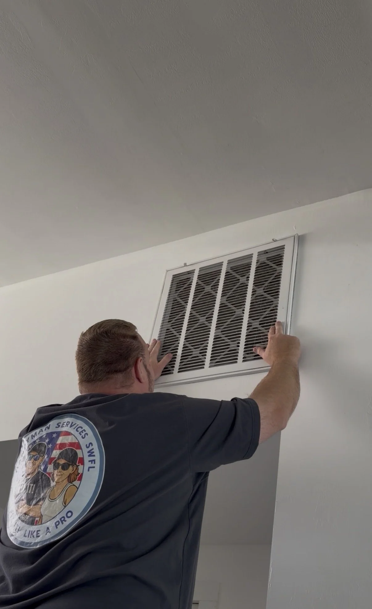 Image of us installing a vent in someone's home.