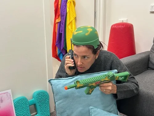 Sarah Everett playing with toys in the Flourish Within therapy room