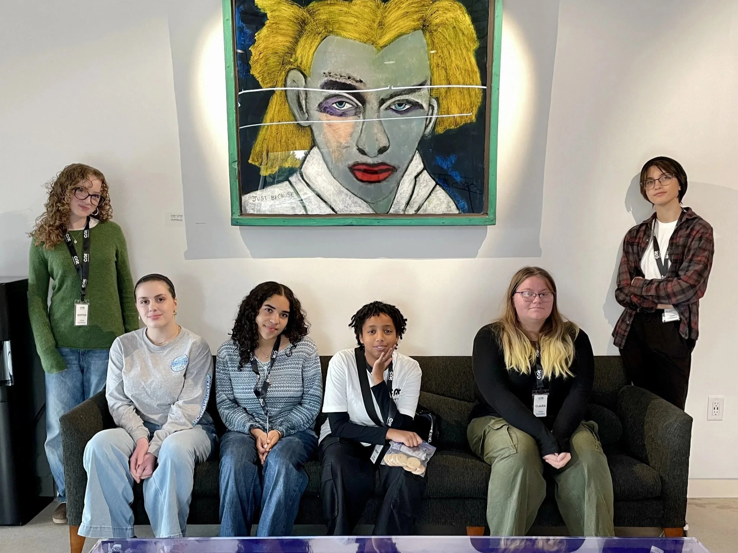 The 2024 Teen Council members posing in the museum lobby.