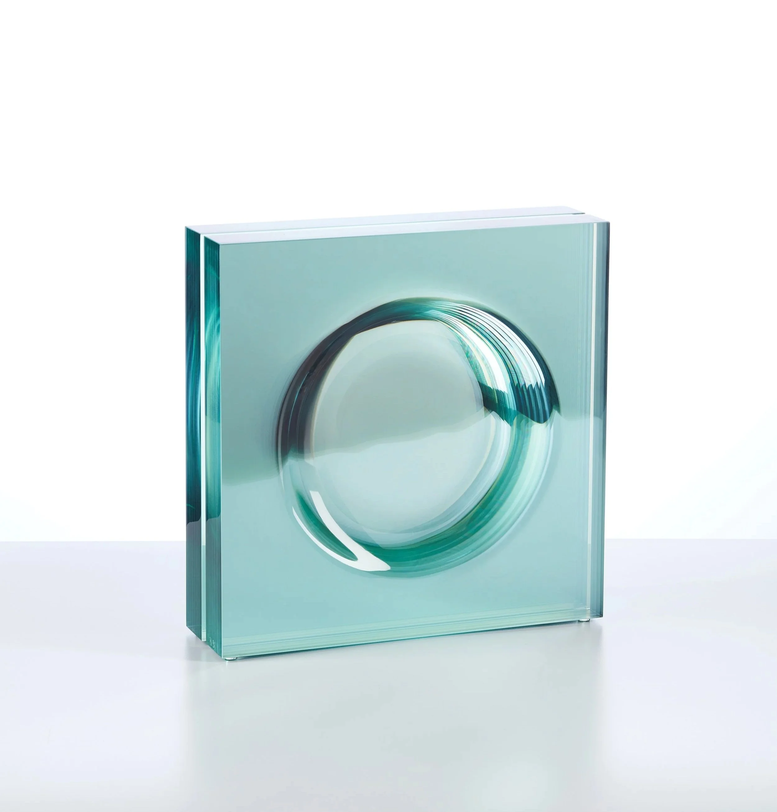Toshio Iezumi (Japanese, b. 1954).  Surface 9 , circa 1995. Heat reflecting glass, glued, carved, and polished. 13 x 13 x 3 5/8 inches. Cafesjian Art Trust Museum. 2022.2153.1. © Toshio Iezumi