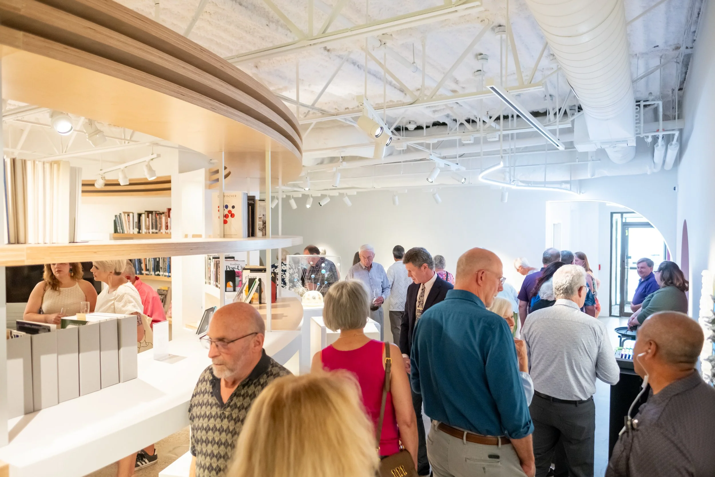 A large group of people in the museum. 