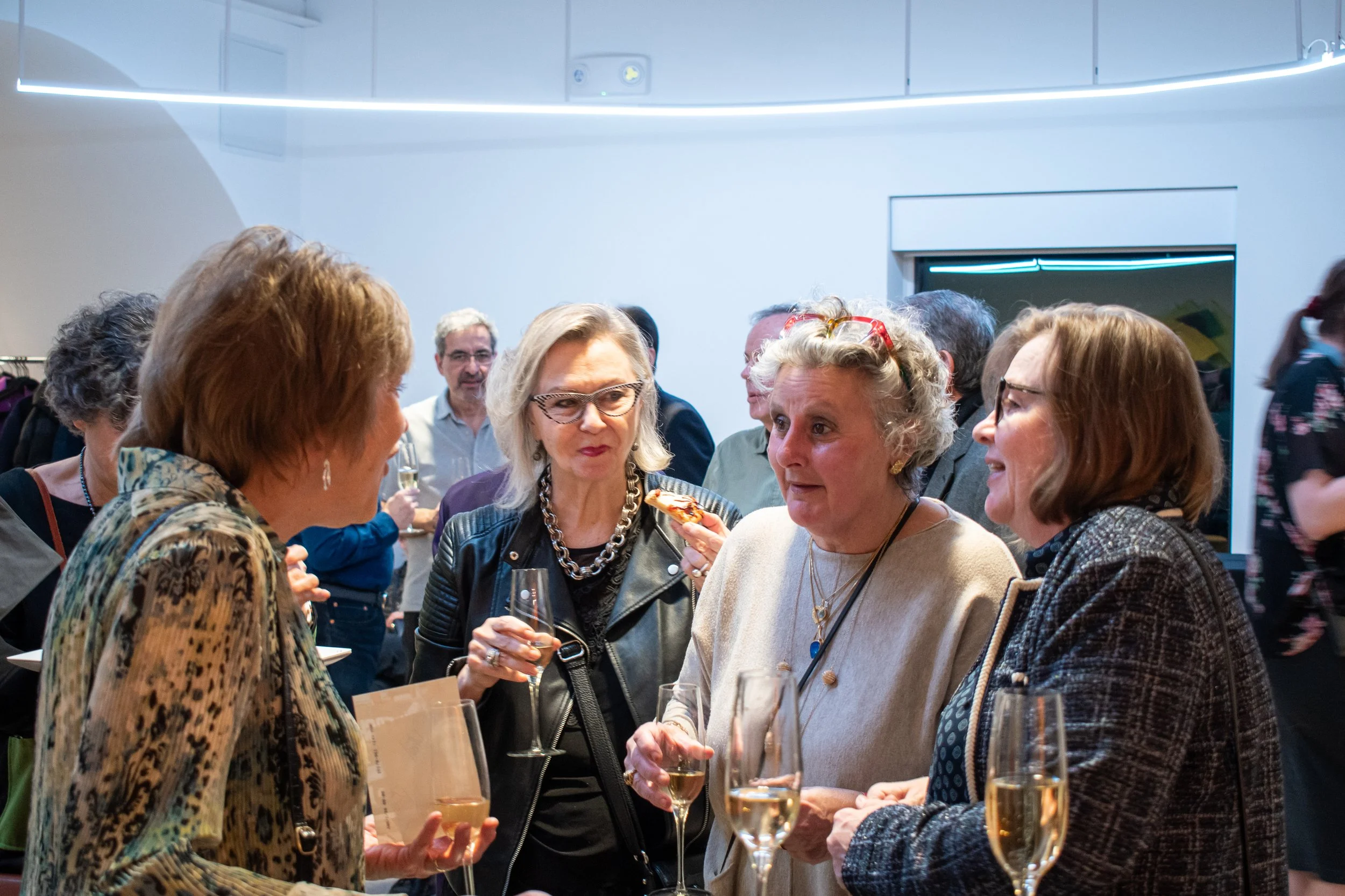 Women chatting in the museum lobby.